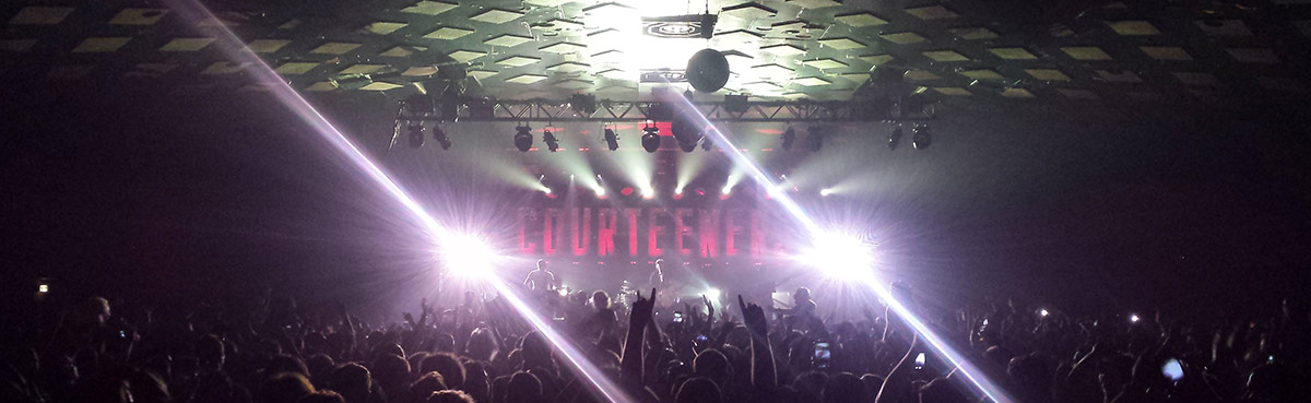 Stage lights and a crowd at a Courteeners show
